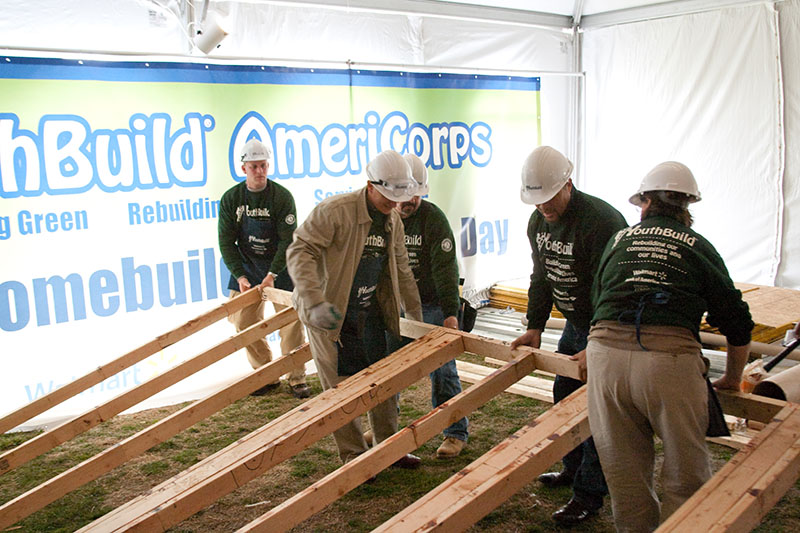 YouthBuild AmeriCorps members and Corporation for National and Community Service staff work on a wall frame during an event marking the 30th anniversary of YouthBuild on the National Mall in Washington, DC. Although funded through the Department of Labor’s Employment and Training Administration, YouthBuild projects cover a wide range of functional areas, including education, housing, and crime prevention. (Photo: Corporation for National and Community Service)