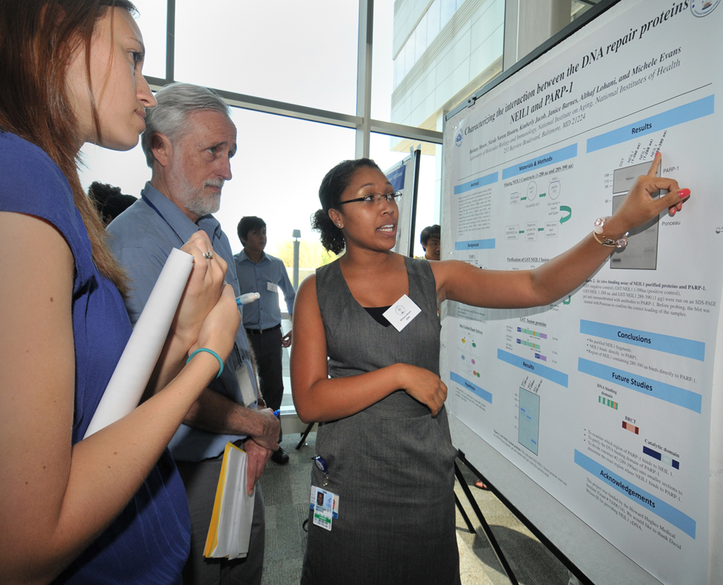 Spelman College Junior Brittany Moore discusses her DNA research at the National Institute on Aging Biomedical Research Center in Baltimore, MD. In 1924, Spelman was the first historically black college to receive its collegiate charter, and minority-serving institutions like Spelman are a focus for funding under Title III and Title V of the Higher Education Act of 1964. (Photo: National Institutes of Health/National Institute on Aging)